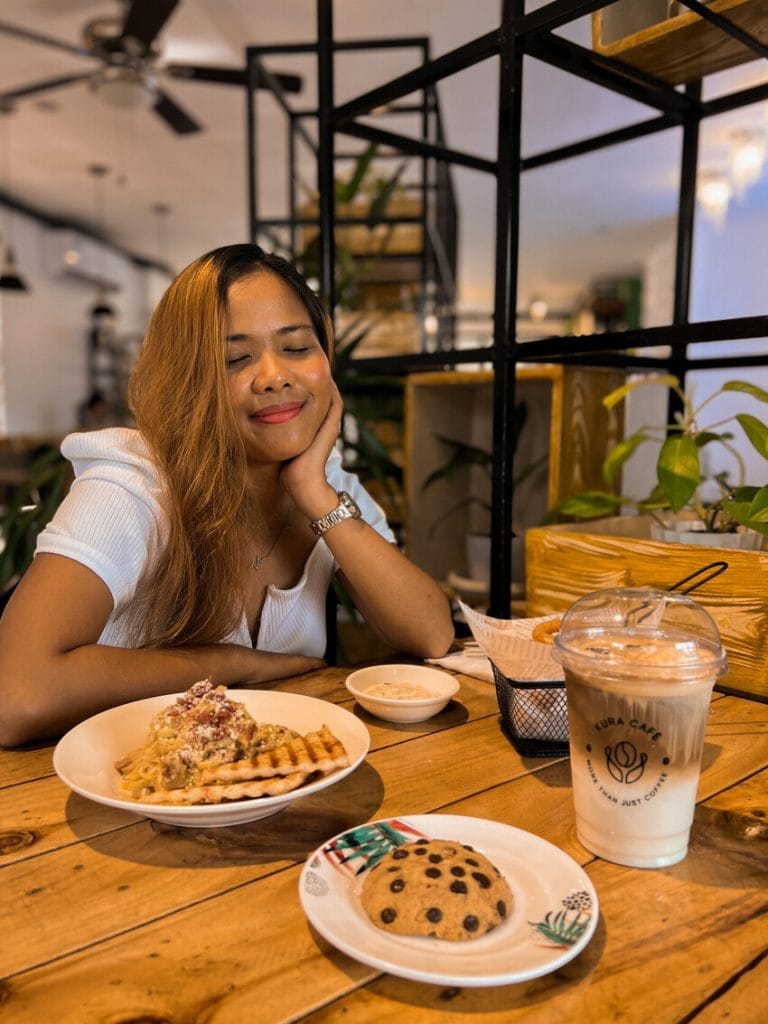 a brown skinned girl in a cafe